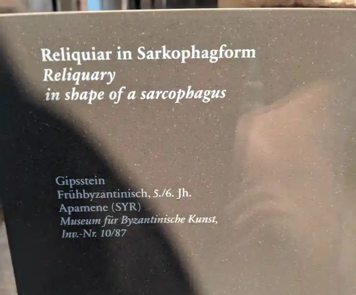 Early Byzantine reliquary in sarcophagus form with carved cross medallions